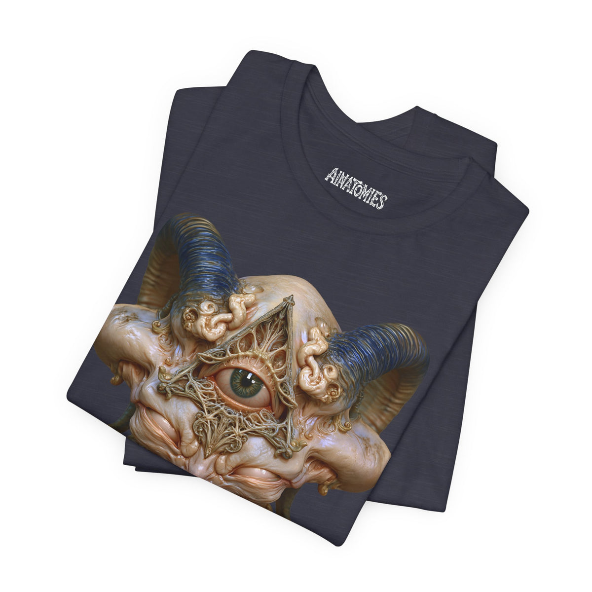 Folded The Unseen Order T-Shirt in Heather Midnight Navy, showing a close view of an ivory otherworldly face with a green forehead eye and blue horns.