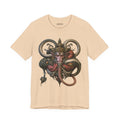 Front of The Weight of a Vow T-Shirt in Heather Sand Dune, featuring a crowned mythic face with curling olive and coral forms.