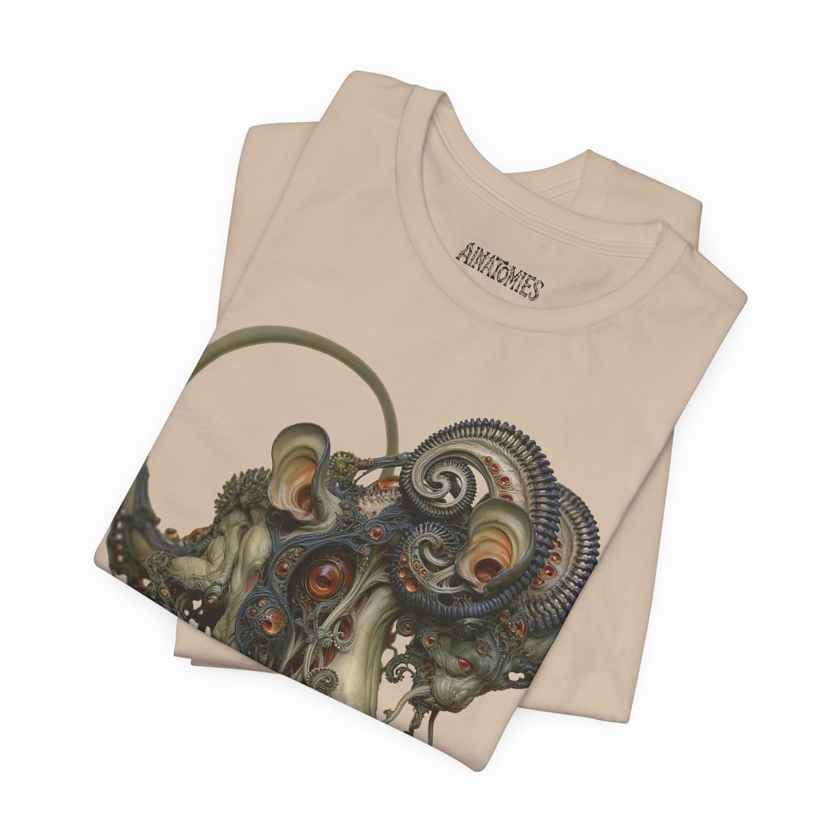 Folded Before the Light Returns T-Shirt in Tan, showing a close view of an ornate olive and bronze creature with a curled tail.