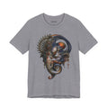Front of The First Becoming T-Shirt in Heather Storm, featuring a surreal face with blue curves, orange accents and an ornate circular crown.