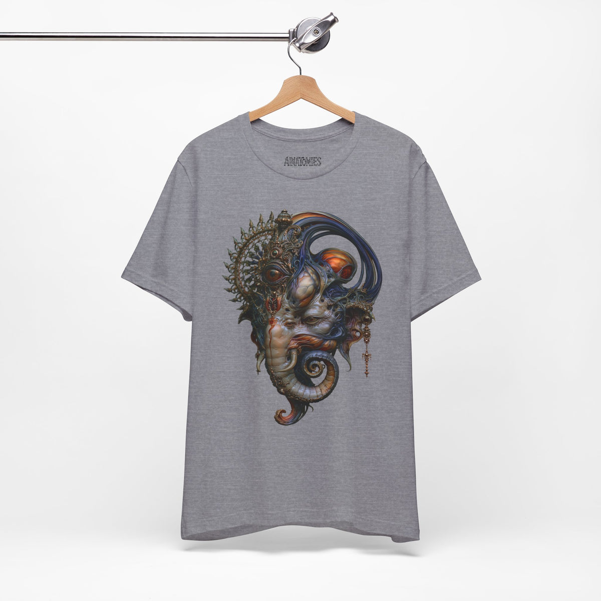 Hanging front view of The First Becoming T-Shirt in Heather Storm, featuring a surreal face with blue curves, orange accents and an ornate circular crown.