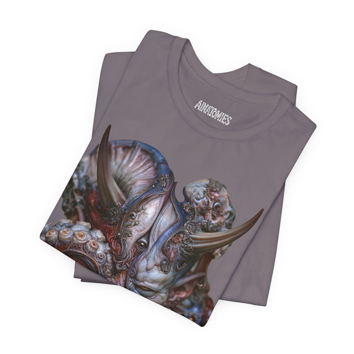 Folded The Patience of Wrath T-Shirt in Storm, showing a close view of a horned face surrounded by blue, violet and coral forms.