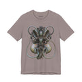 Front of The Thread That Holds T-Shirt in Pebble Brown, featuring an ornate guardian portrait with green, blue and ivory curls.