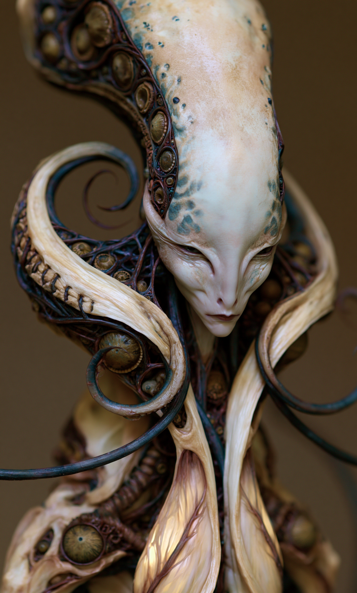 Elongated pale face framed by curling ivory forms, indigo filaments and bronze eye-like orbs in Invited Before You Existed by AINATOMIES.